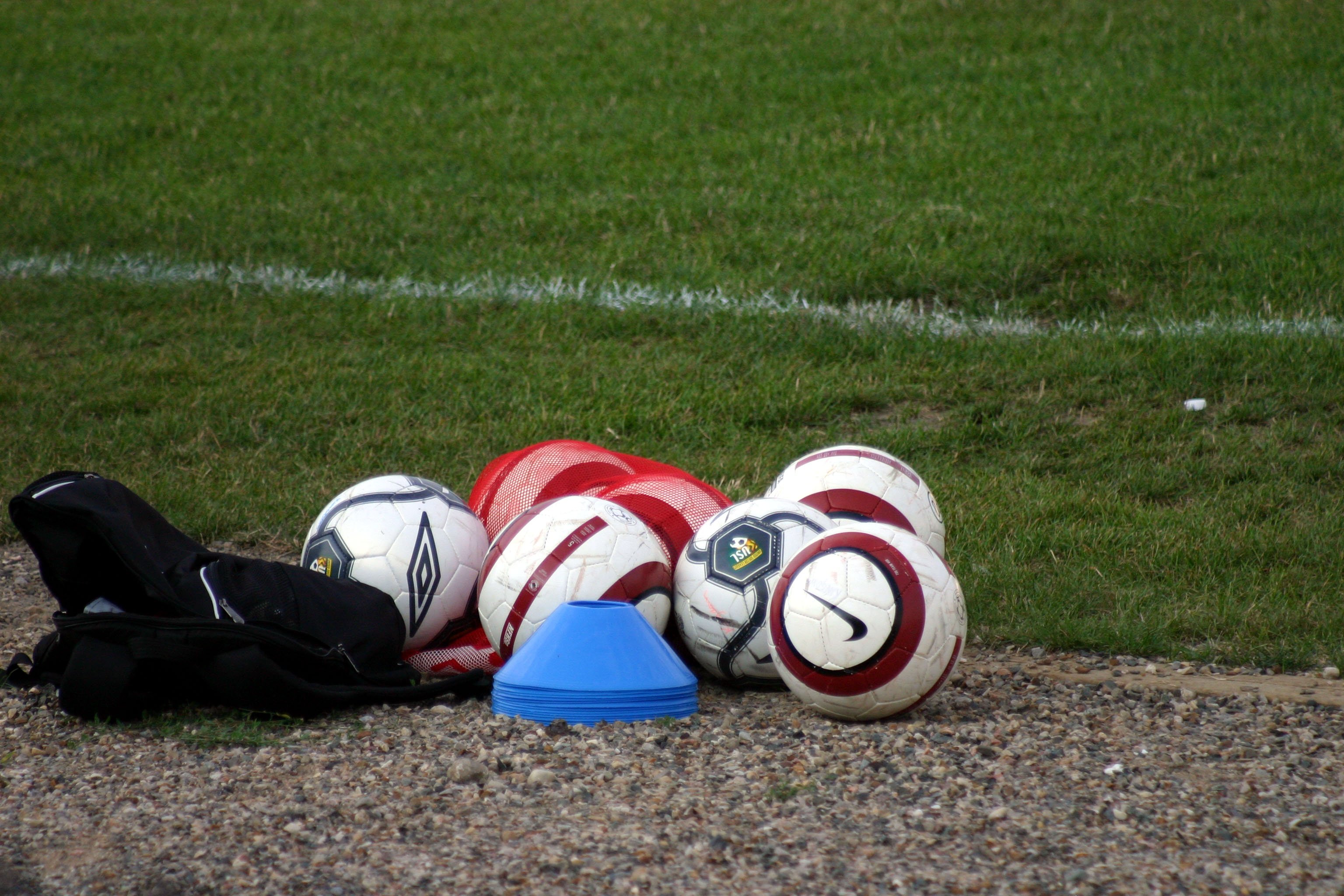 Set of footballs on a playing field